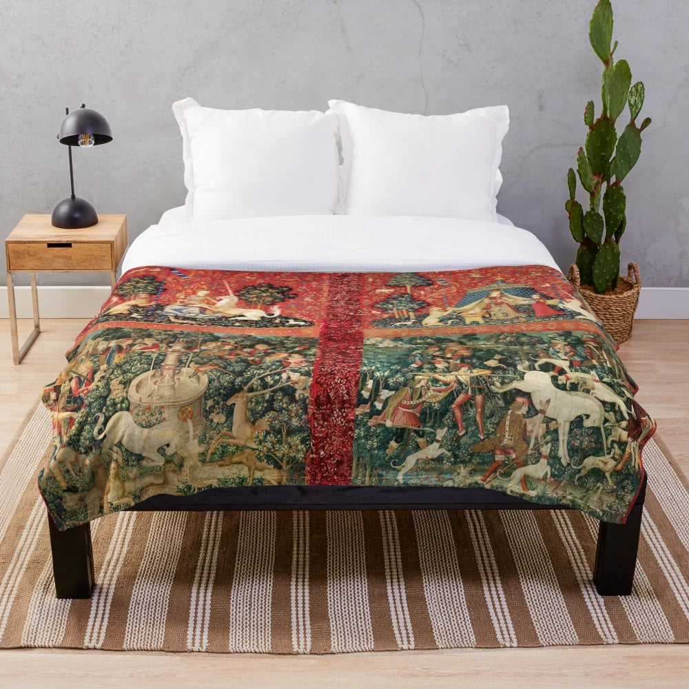 Plush blanket featuring a medieval-style illustration of a unicorn and ladies in a fantasy floral garden