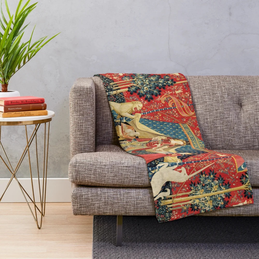 Plush blanket with medieval-inspired floral tapestry design featuring a unicorn and lion
