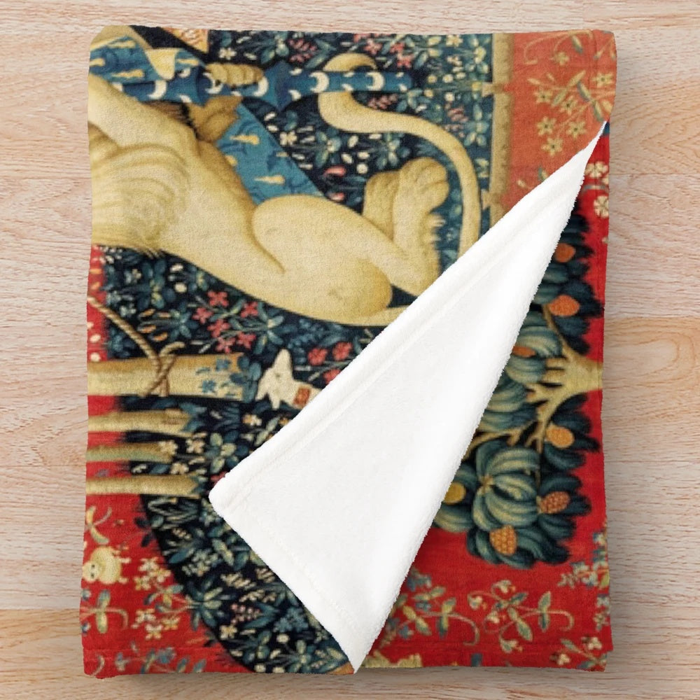 Plush blanket with medieval-inspired floral tapestry design featuring a unicorn and lion