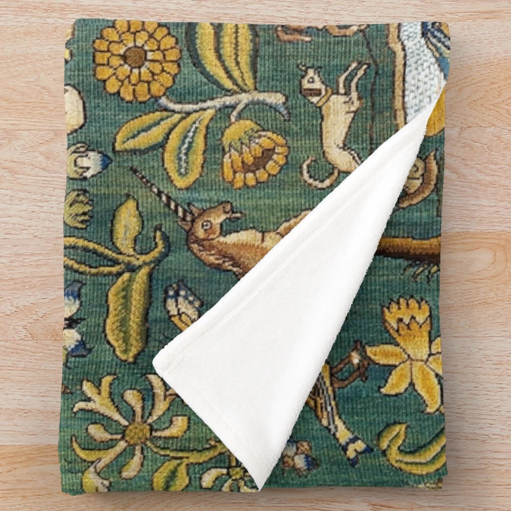 Plush blanket featuring a medieval floral tapestry design with mythical unicorns