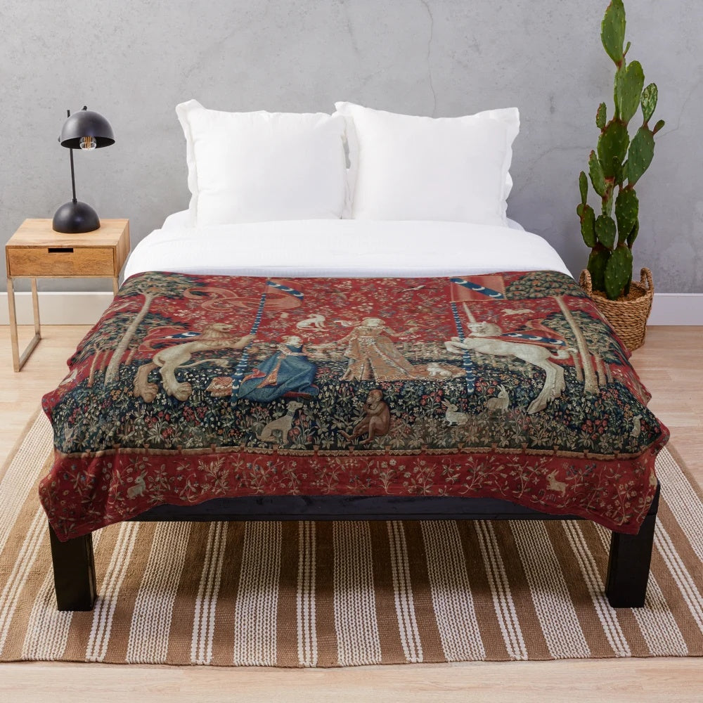 Soft, plush blanket featuring a medieval-inspired tapestry design with a unicorn and lady