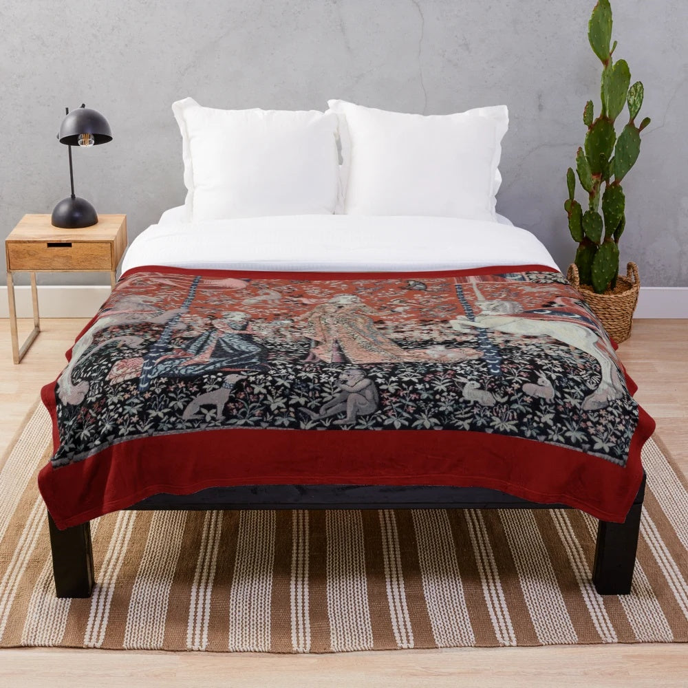 Soft, plush blanket featuring a medieval tapestry design with a magical unicorn