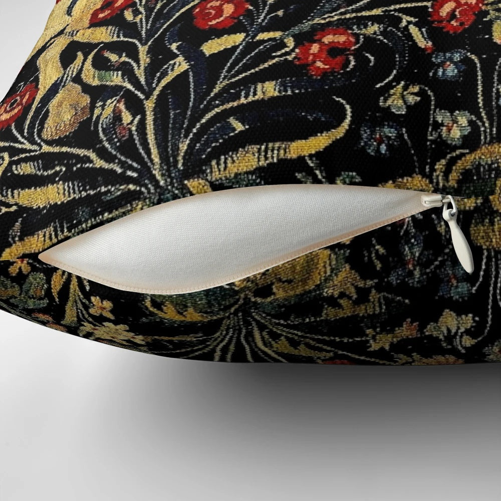 Decorative medieval-style pillow featuring a mythical unicorn surrounded by a lush black floral tapestry design.
