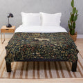 Medieval unicorn plush blanket with midnight floral design
