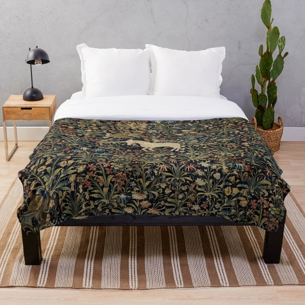 Medieval unicorn plush blanket with midnight floral design