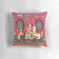 Elegant medieval unicorn tapestry pillow featuring the iconic "Lady and the Unicorn" scene with a unicorn and a lady in a lush floral setting.
