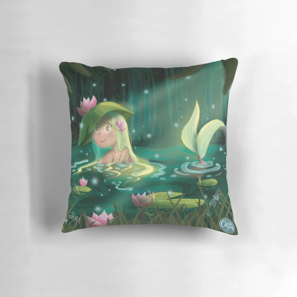 Whimsical mermaid illustration on a decorative pillow, set in a tranquil lily pond