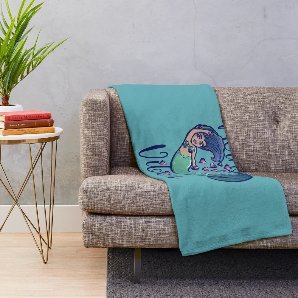 Mermaid-themed plush blanket in vibrant colors
