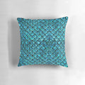 A soft, plush pillow featuring a beautiful mermaid scales design, perfect for adding a touch of magical ocean-inspired style to your home.