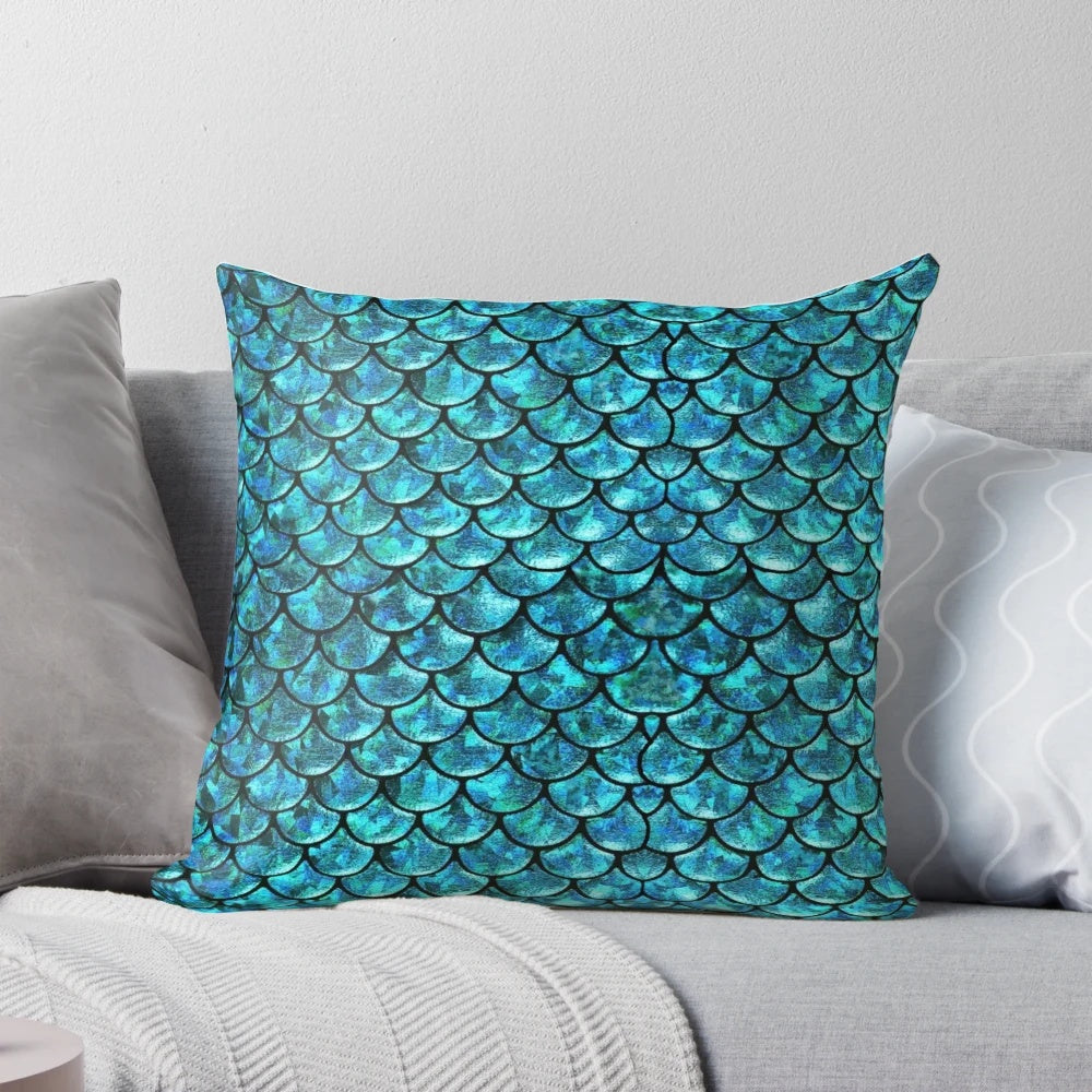 A soft, plush pillow featuring a beautiful mermaid scales design, perfect for adding a touch of magical ocean-inspired style to your home.