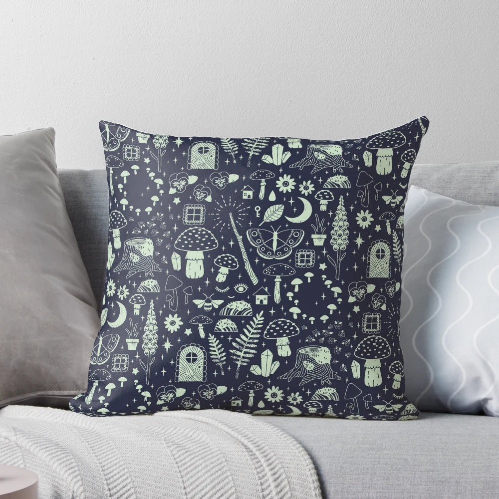 Whimsical fairy garden pillow with midnight design featuring mushrooms, butterflies, and flowers