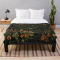 Midnight floral plush blanket with mythical creature design