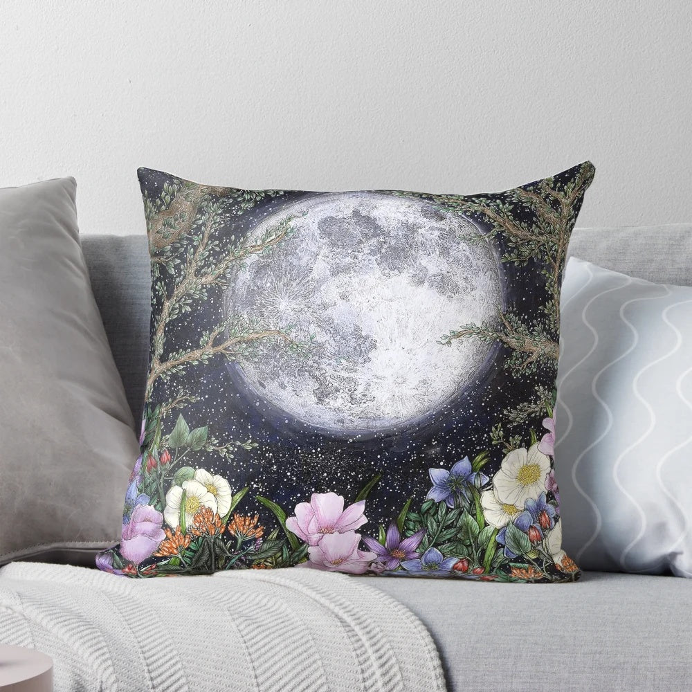 A beautiful pillow with a detailed illustration of a moonlit garden scene.