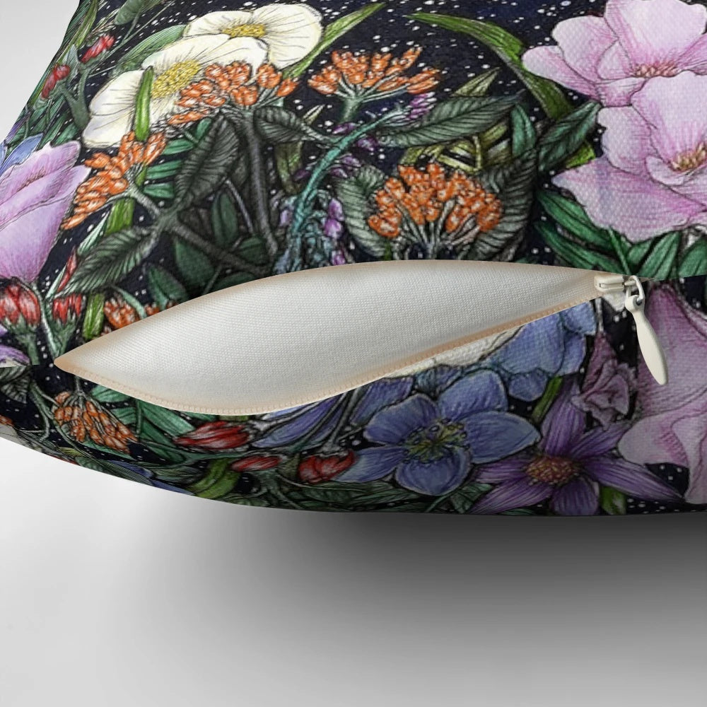 A beautiful pillow with a detailed illustration of a moonlit garden scene.