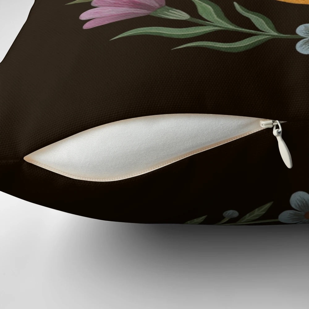 A decorative pillow featuring a beautiful moon and floral design, perfect for a cozy and serene bedroom.