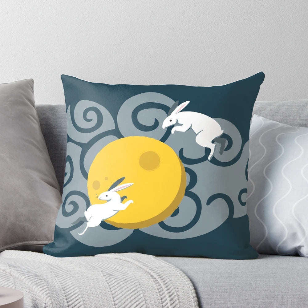 Whimsical moon bunnies pillow featuring cute rabbits against a cloudy night sky