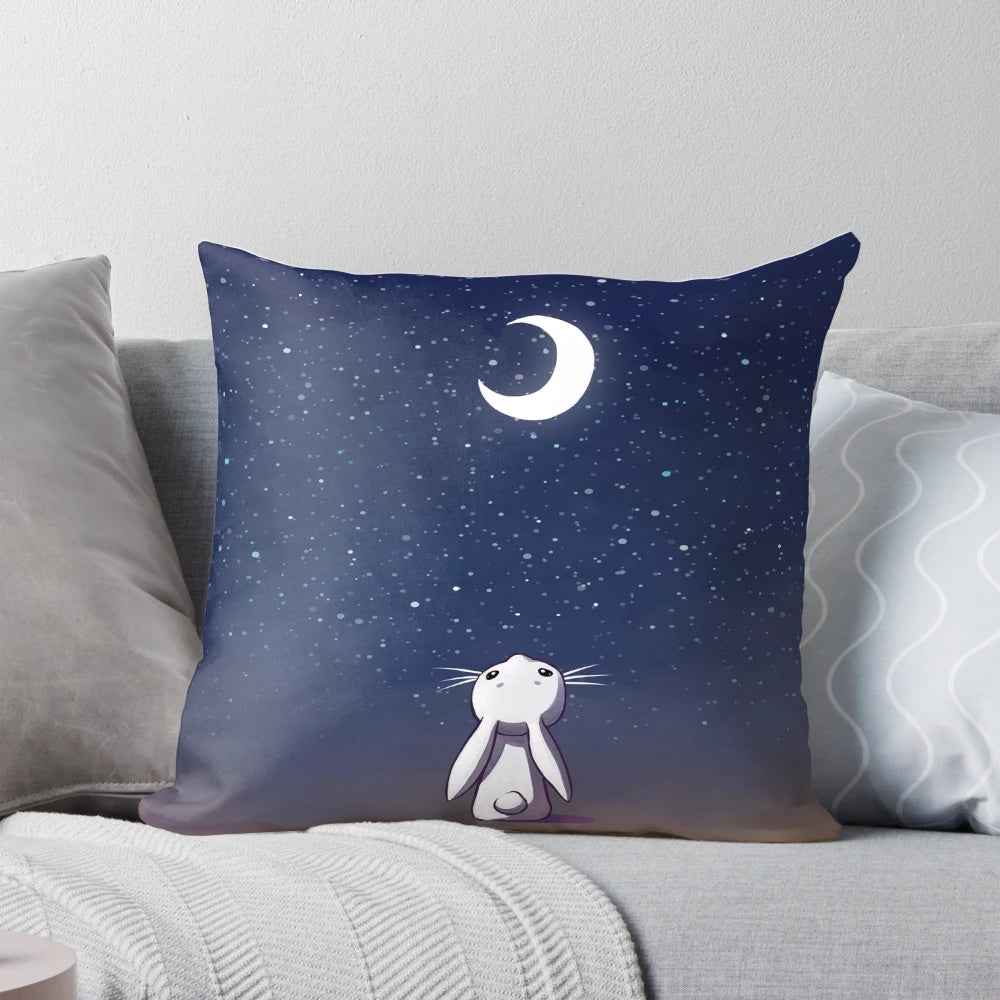 Soft and cuddly moon bunny plush pillow with starry night design