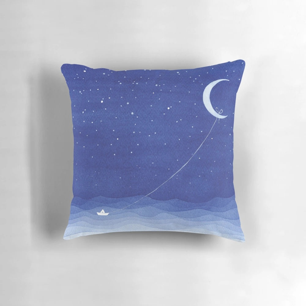 Serene watercolor painting of a sailboat on the moonlit ocean, featured on a soft, plush pillow