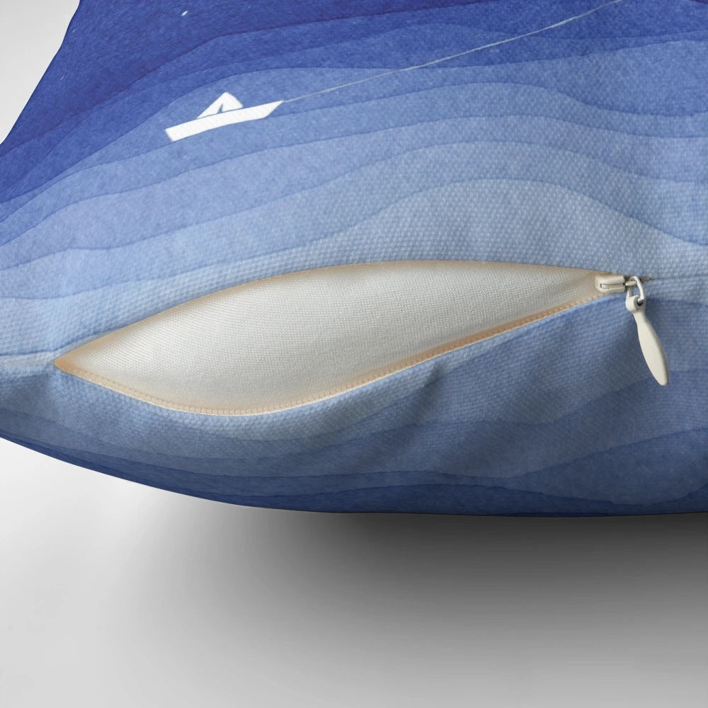 Serene watercolor painting of a sailboat on the moonlit ocean, featured on a soft, plush pillow