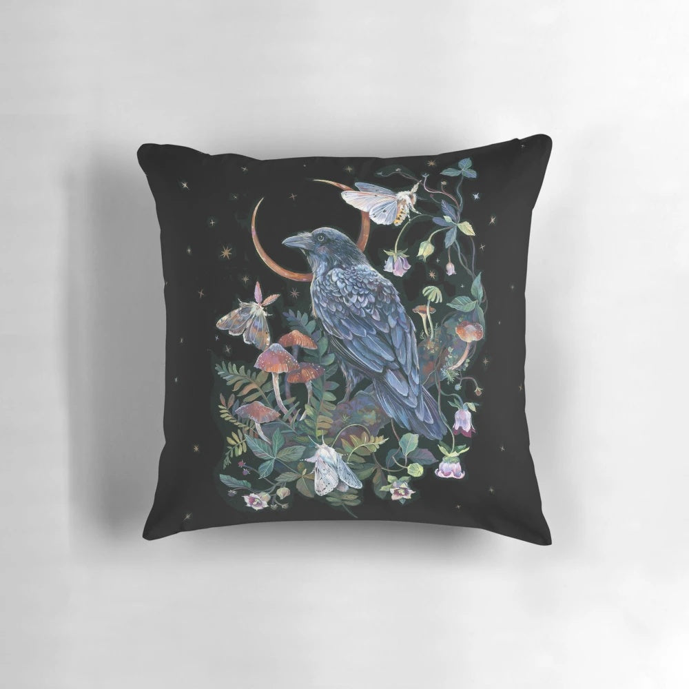 A whimsical throw pillow featuring a raven against a starry night sky and moon, surrounded by botanical elements.
