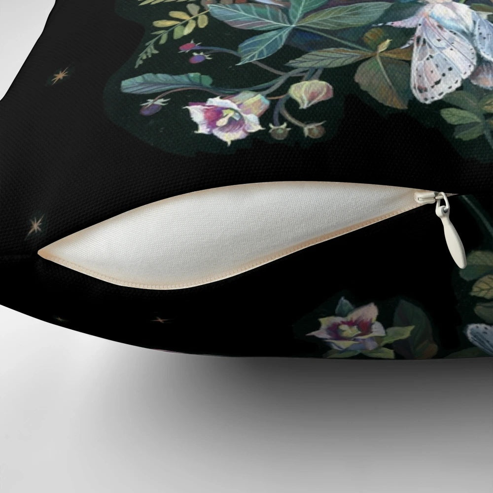A whimsical throw pillow featuring a raven against a starry night sky and moon, surrounded by botanical elements.