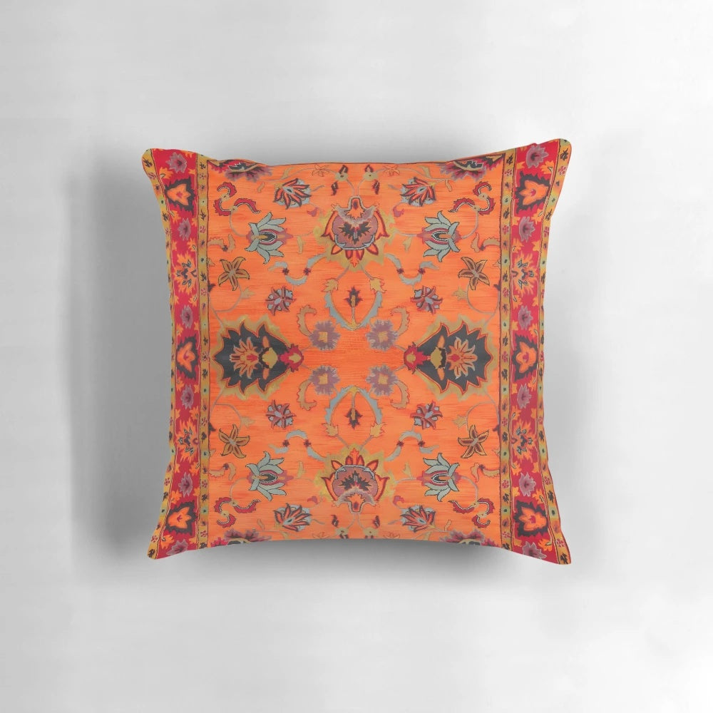 Moroccan sunset-inspired bohemian pillow featuring vibrant orange and cultural motifs