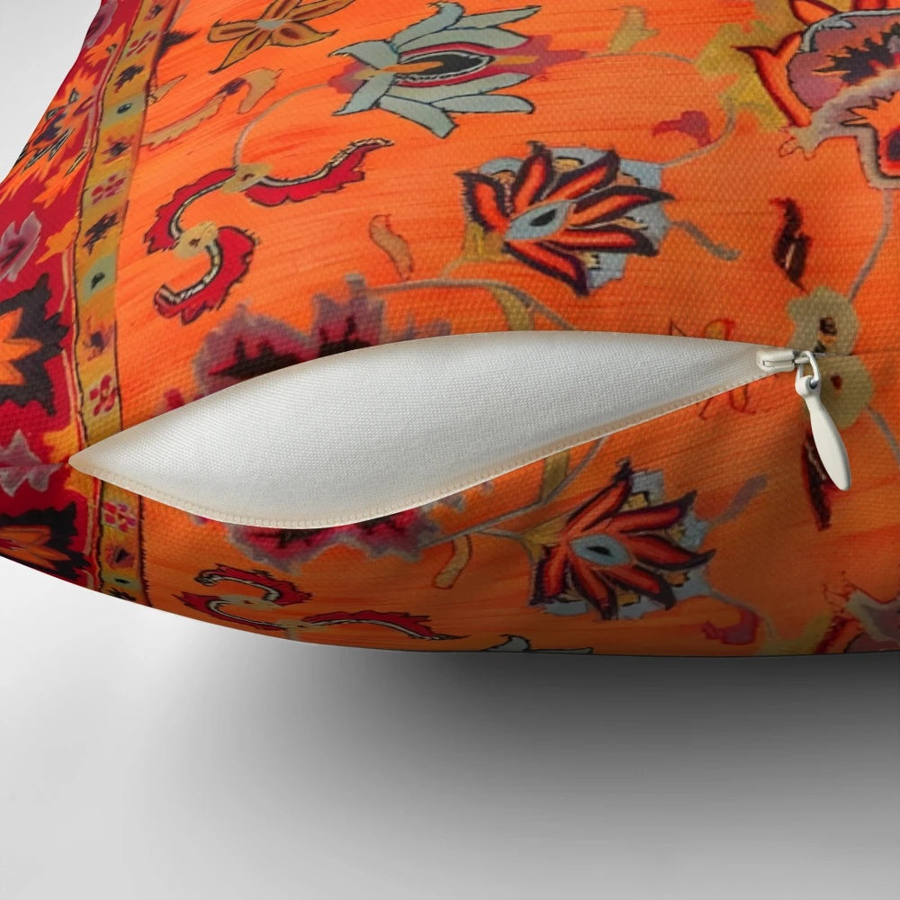 Moroccan sunset-inspired bohemian pillow featuring vibrant orange and cultural motifs