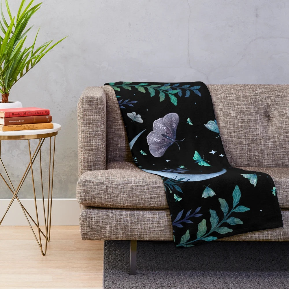 Plush blanket with enchanting moth garden design