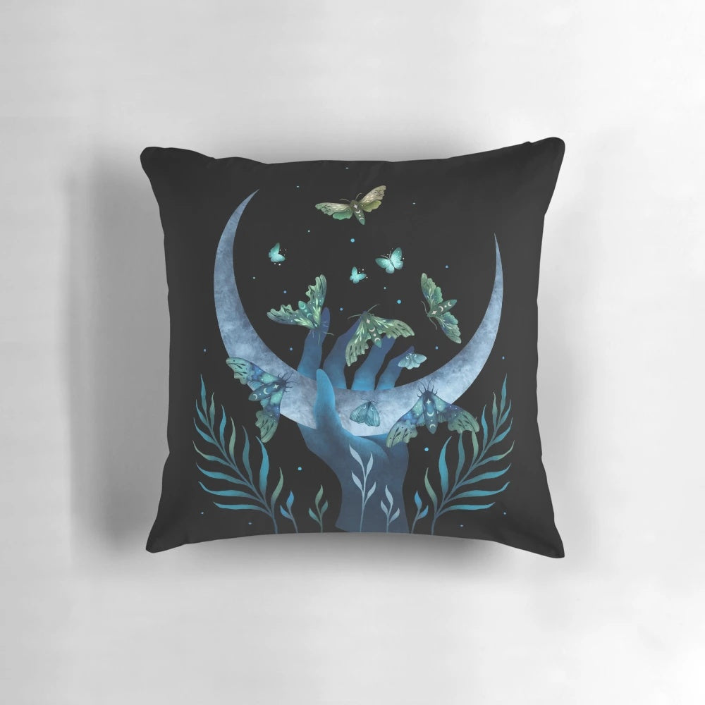 Detailed image of a decorative pillow featuring a whimsical moth design, perfect for a mystical night garden theme.