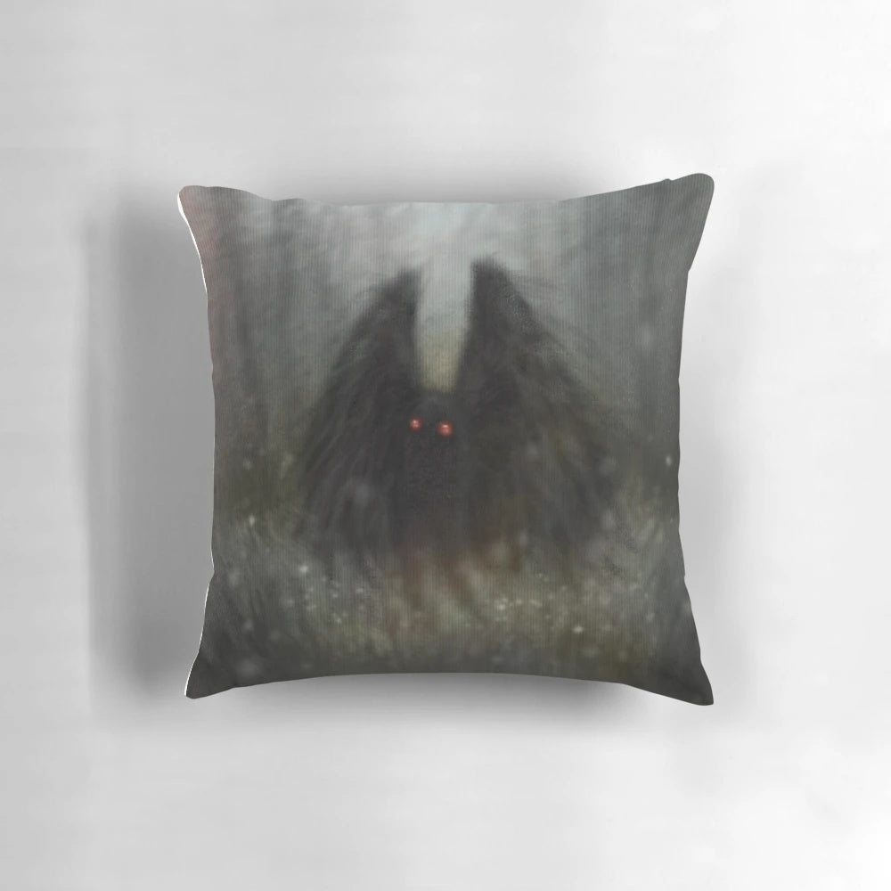 Soft, cozy pillow featuring the mysterious Mothman cryptid in a forest setting with wisps of light.