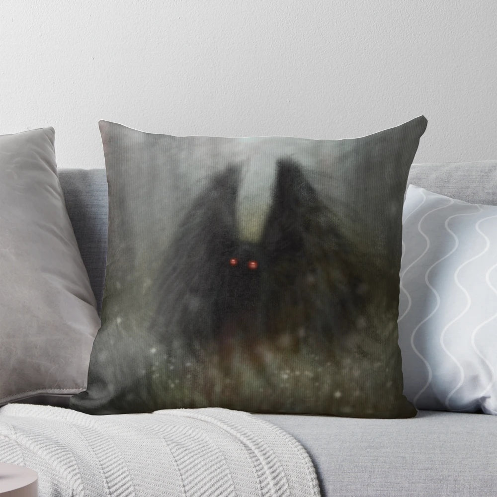 Soft, cozy pillow featuring the mysterious Mothman cryptid in a forest setting with wisps of light.