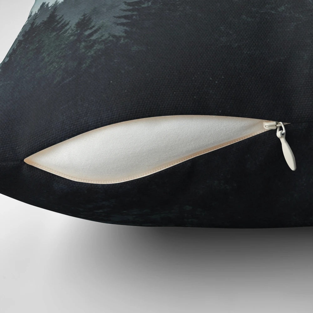 A cozy mountain light pillow with a serene, misty forest landscape design