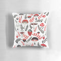 A decorative pillow featuring a whimsical design of magical mushrooms and acorns in a forest setting