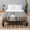 Plush blanket featuring a whimsical mushroom forest design
