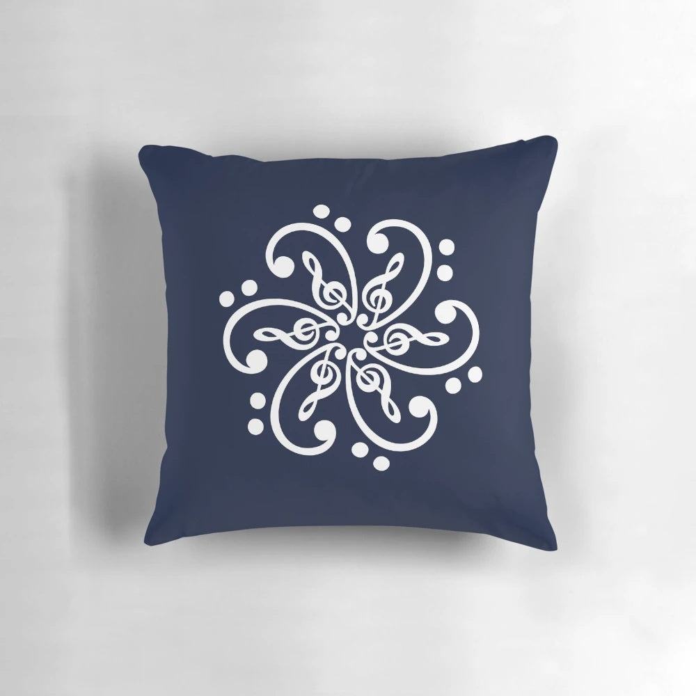 Decorative throw pillow featuring a mandala design with musical elements like bass clef, treble clef, and musical notes.