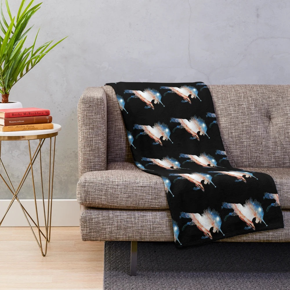 Plush blanket with a silhouette of a rearing unicorn against a galaxy background