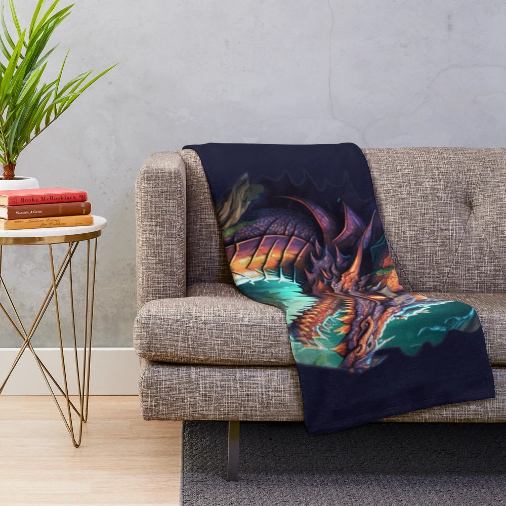 Plush blanket featuring a design of various mythical creatures and fantasy beings