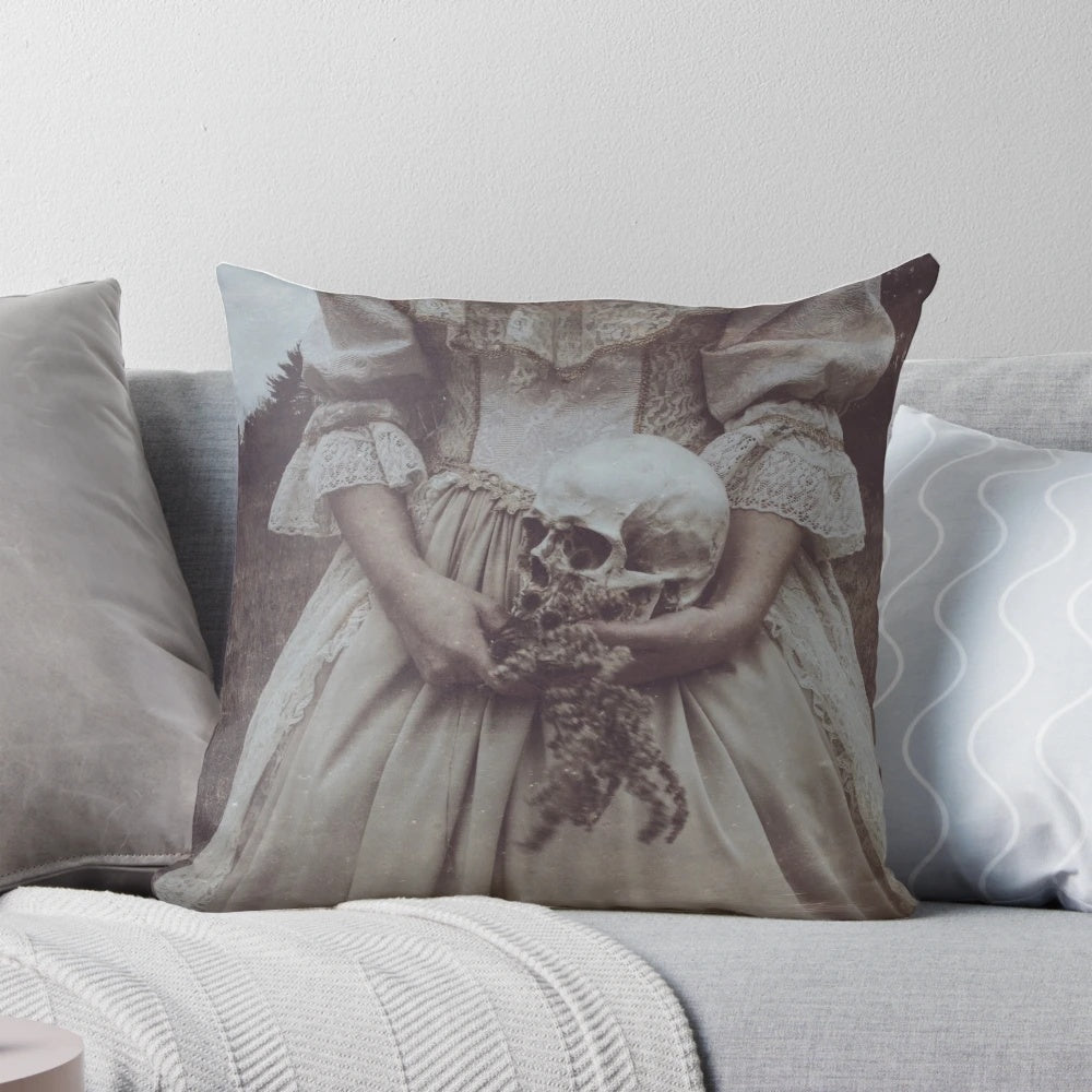 A soft, nature-inspired pillow featuring a delicate pastel skull design, perfect for adding a touch of gothic elegance to any space.