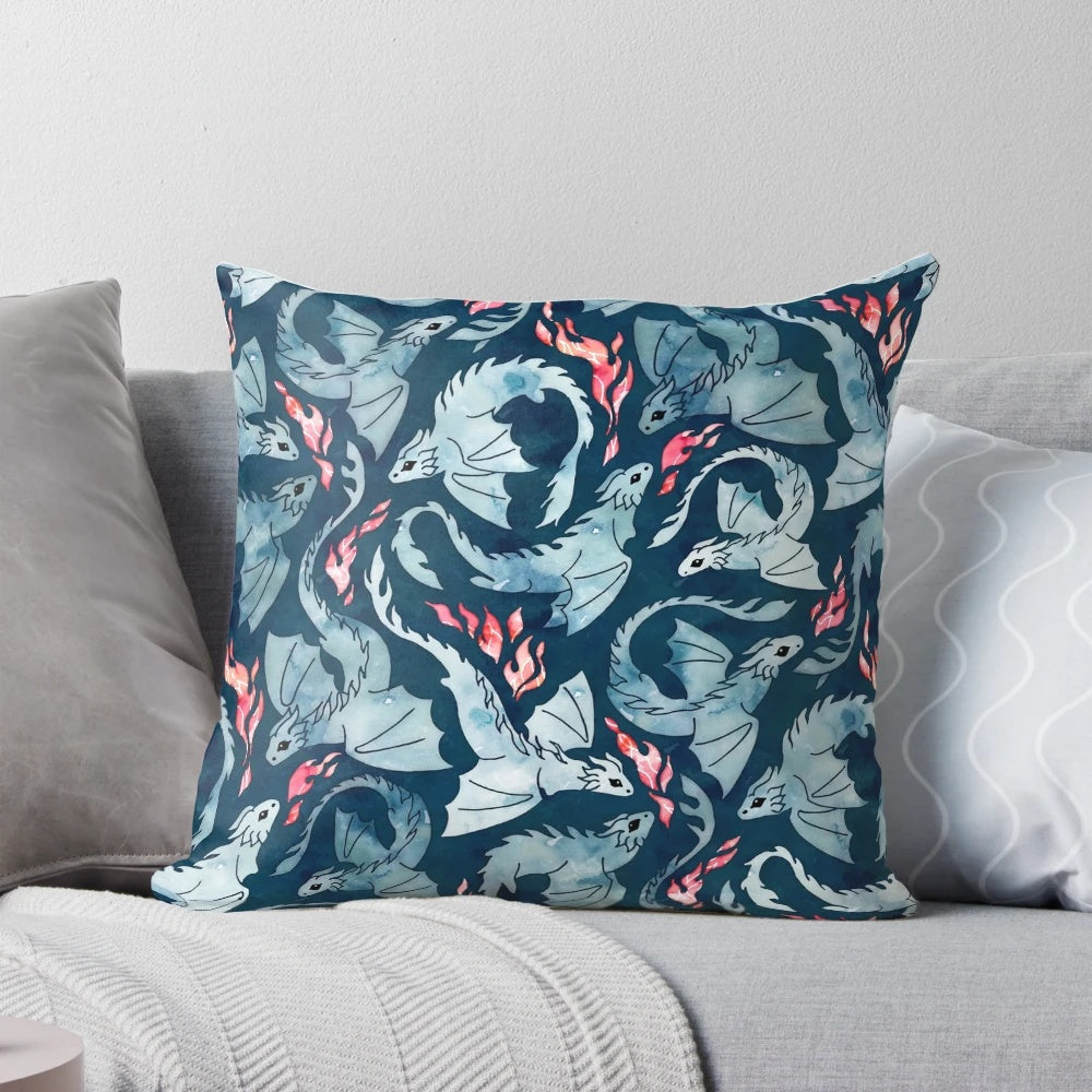 Navy blue pillow with a seamless watercolor design of a cute fire-breathing dragon