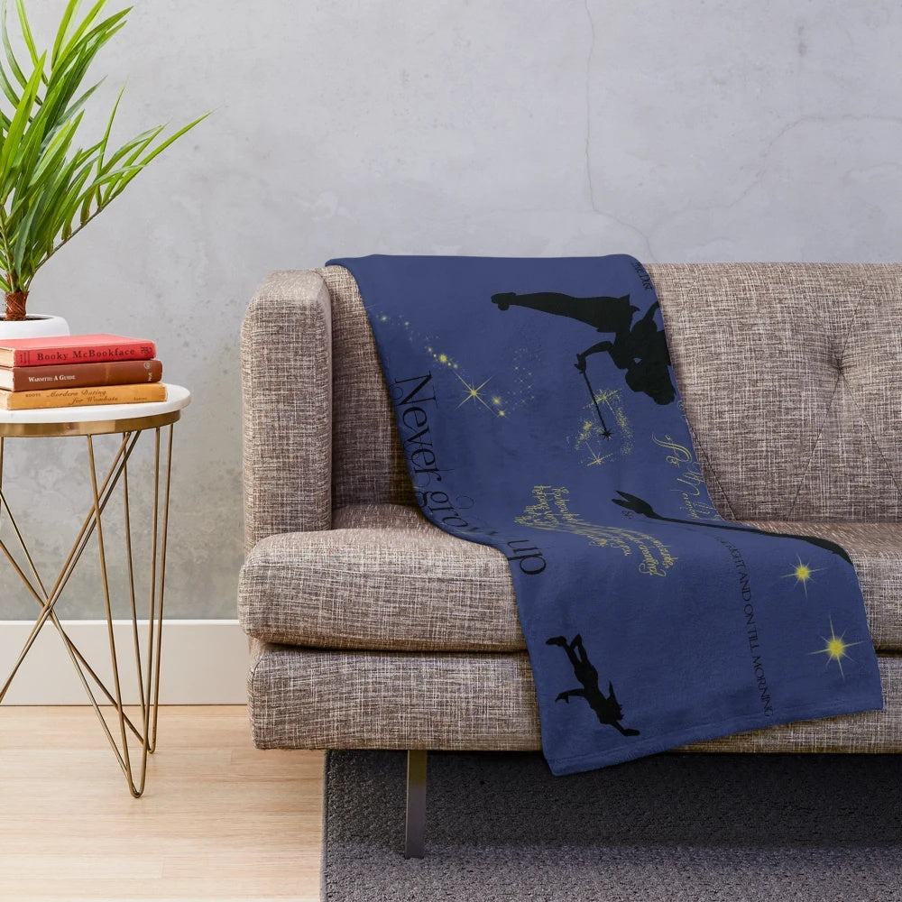 Neverland-inspired plush blanket with silhouettes and midnight blue hues