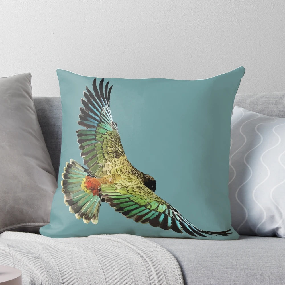 A plush pillow featuring the vibrant colors and unique design of the New Zealand kea, a native alpine parrot.