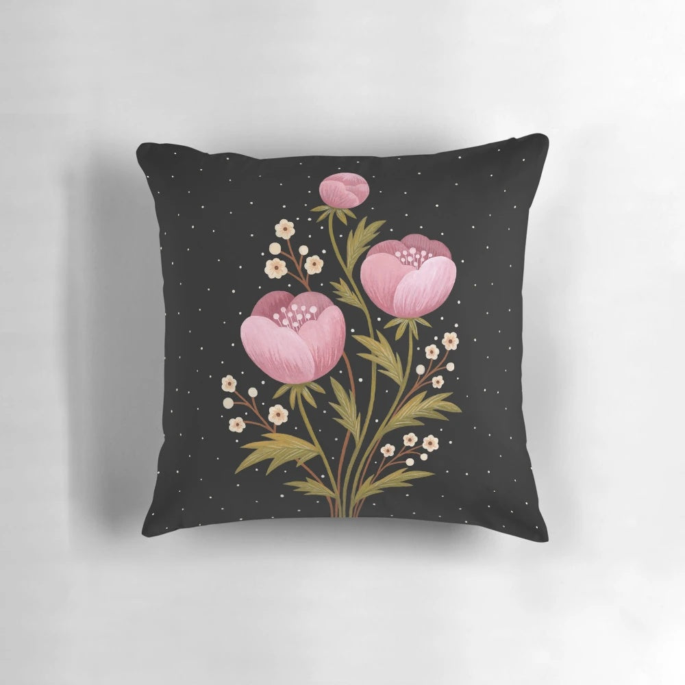 A dark, moody pillow featuring a gouache painting of night blooming flowers and botanicals.
