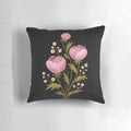 A dark, moody pillow featuring a gouache painting of night blooming flowers and botanicals.