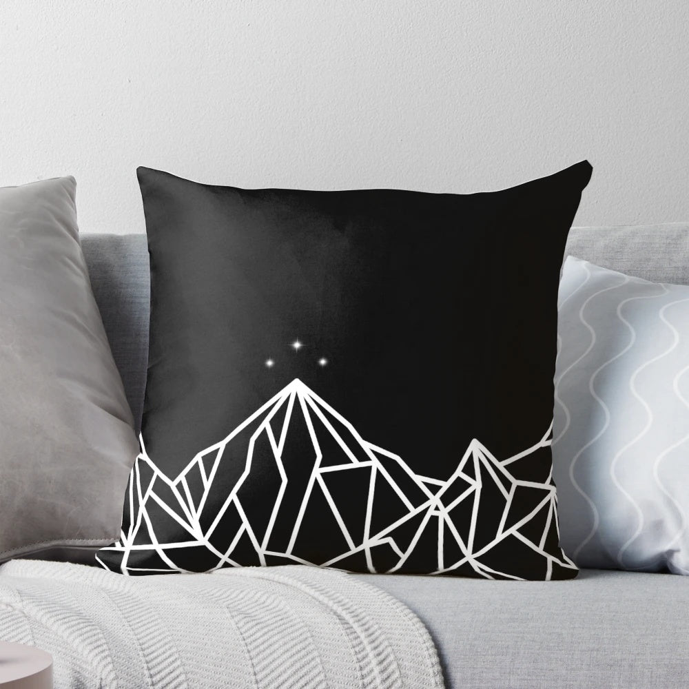 Decorative pillow featuring a geometric mountain design inspired by the Night Court from the A Court of Thorns and Roses series by Sarah J. Maas.