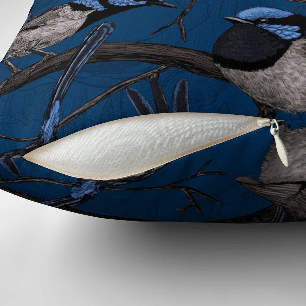 Vibrant blue and white pattern of a night fairy wren bird on a decorative throw pillow.