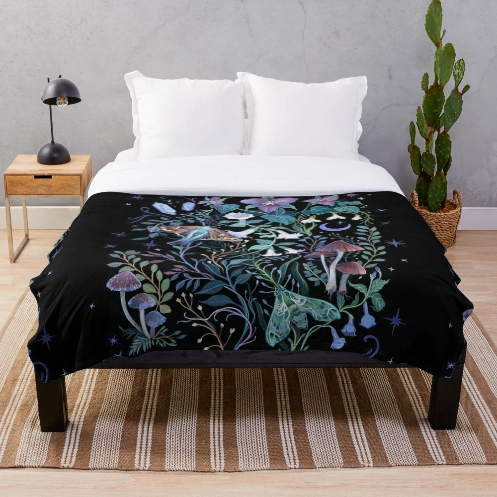 Soft and cozy plush blanket featuring a whimsical moth design against a starry night sky