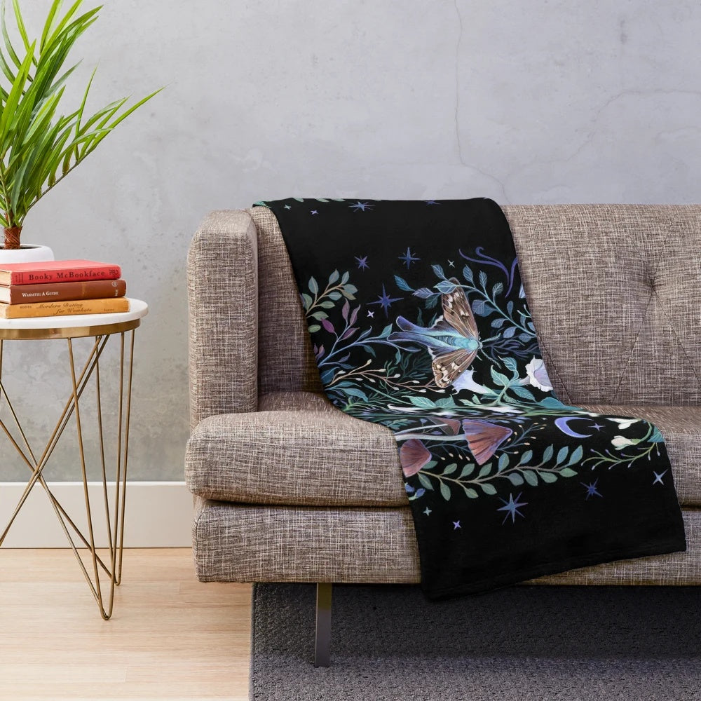 Soft and cozy plush blanket featuring a whimsical moth design against a starry night sky