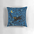 Decorative throw pillow with a whimsical night sky and botanical design featuring a black cat
