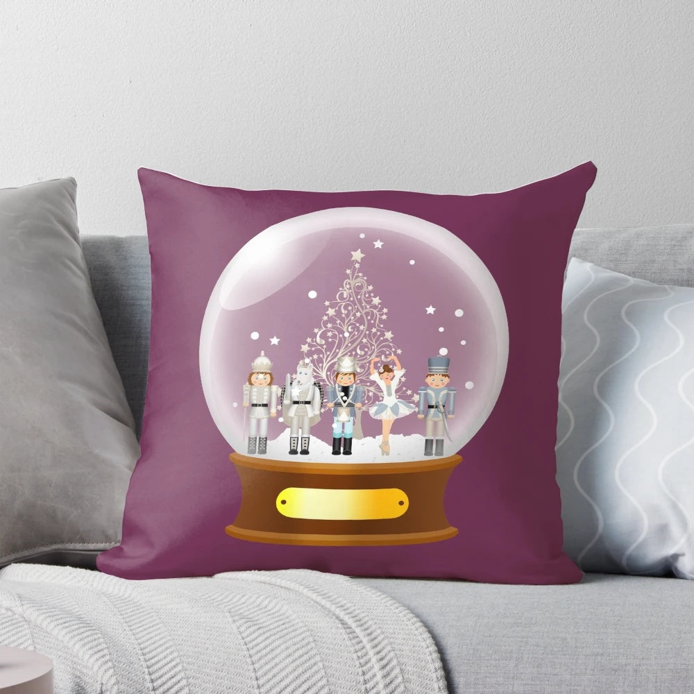 A cozy Christmas pillow featuring a snow globe with a nutcracker ballet scene, perfect for holiday decor.