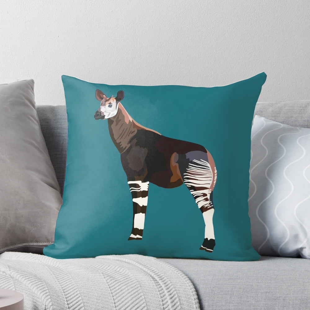 Colorful illustration of an okapi, an endangered rainforest animal, on a soft throw pillow.